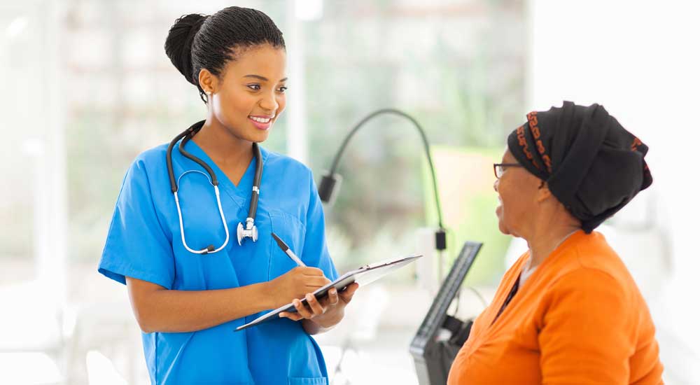 female doctor talking with female patient